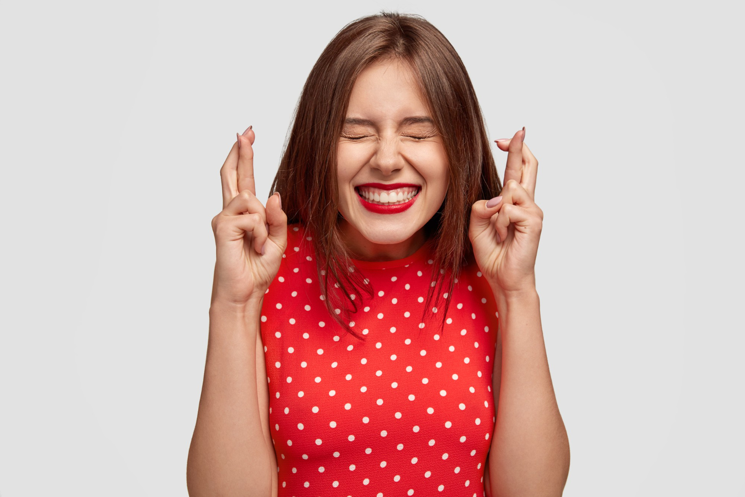 Woman with crossed fingers